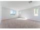 Spacious bedroom with large windows and carpeted floors at 9405 Ara Pl, Las Vegas, NV 89143