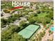 Aerial view showing a house and tennis court in a community at 11074 Caramel Crest Ct, Las Vegas, NV 89135