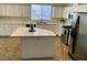 Kitchen with island, stainless steel appliances, and white cabinets at 11074 Caramel Crest Ct, Las Vegas, NV 89135