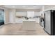 Modern kitchen with island, white cabinets, and stainless steel appliances at 11074 Caramel Crest Ct, Las Vegas, NV 89135