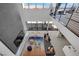 Two-story living room with a focal fireplace and modern decor at 28 Rainbow Point Pl, Henderson, NV 89011