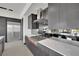 Modern kitchen with stainless steel appliances and dark cabinetry at 28 Rainbow Point Pl, Henderson, NV 89011