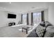 Spacious living room featuring tile floors and sliding glass doors leading to a deck at 5960 Aurora Gold Ave, Las Vegas, NV 89141