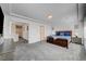 Large main bedroom with wood-look flooring and en-suite bathroom at 5960 Aurora Gold Ave, Las Vegas, NV 89141