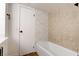 Clean bathroom with updated tile and a bathtub at 205 E Harmon Ave # 1009, Las Vegas, NV 89169