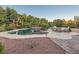 Freeform pool with a spacious patio and plenty of seating at 8420 Lake Tahoe View Ct, Las Vegas, NV 89143