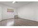 Simple bedroom with light gray walls and wood-look flooring at 3353 E Rochelle Ave, Las Vegas, NV 89121