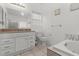 Elegant bathroom with double vanity and a soaking tub at 3353 E Rochelle Ave, Las Vegas, NV 89121