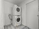 Clean laundry room with stacked washer and dryer at 3353 E Rochelle Ave, Las Vegas, NV 89121