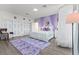 Stylish bedroom with a purple theme and plenty of light at 3353 E Rochelle Ave, Las Vegas, NV 89121