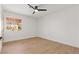 Well-lit bedroom with a window and wood-look flooring at 2820 Lotus Hill Dr, Las Vegas, NV 89134