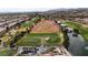 Aerial view of a golf course with pond and surrounding community at 2820 Lotus Hill Dr, Las Vegas, NV 89134