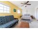 Bedroom with futon, ceiling fan, and large window at 3949 S Torrey Pines Dr, Las Vegas, NV 89103