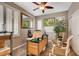 Home office featuring wood desk, chairs, and plantation shutters at 4017 Kristina Lynn Ave, North Las Vegas, NV 89081