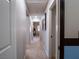 Bright hallway with carpet and doors to bedrooms at 7125 Mountain Den Ave, Las Vegas, NV 89179