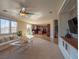 Spacious living room features a large sofa, coffee table, and views into the kitchen at 7125 Mountain Den Ave, Las Vegas, NV 89179