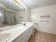 Main bathroom with double sinks, shower, and accessible features at 1366 Falling Snow Ave, Las Vegas, NV 89183