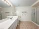 Bathroom with double vanity, shower, and tiled floor at 1366 Falling Snow Ave, Las Vegas, NV 89183