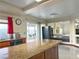 Kitchen with granite island, opens to Gathering room at 1366 Falling Snow Ave, Las Vegas, NV 89183