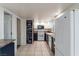 Full view of kitchen with white cabinets, gas range and chalkboard wall at 499 Kristin Ln, Henderson, NV 89011