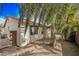 Backyard view of home with palm trees at 10505 Jeremy Ridge Ave, Las Vegas, NV 89144