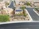 Aerial view of a house with solar panels and a fenced backyard at 2691 Benton Cove St, Laughlin, NV 89029