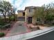 Two story house with a driveway and landscaped yard at 2691 Benton Cove St, Laughlin, NV 89029