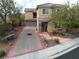 Two story house with a driveway and landscaped yard at 2691 Benton Cove St, Laughlin, NV 89029