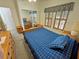 Main bedroom with mirrored closet and large window at 3721 S Sagebrush Ave, Pahrump, NV 89048