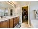 Bathroom boasts double sinks, large closet, and wood cabinets at 7745 Donner Peak St, Las Vegas, NV 89166