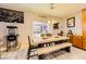 Dining area with a large wooden table and bench seating at 7745 Donner Peak St, Las Vegas, NV 89166