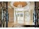 Elegant entryway with chandelier and ornate doors at 9103 Alta Dr # 401, Las Vegas, NV 89145