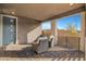 Covered patio with wicker chairs, perfect for relaxing at 476 Morro Strand Ave, Las Vegas, NV 89138