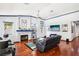 Bright living room with hardwood floors, fireplace, and recessed lighting at 8371 Las Lunas Way, Las Vegas, NV 89129