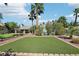 Relaxing backyard with putting green and checkerboard patio at 8371 Las Lunas Way, Las Vegas, NV 89129