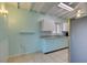 Kitchen with teal cabinets, granite counters, and stainless steel appliances at 620 N 16Th St, Las Vegas, NV 89101