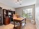 Home office with built-in shelving and large desk at 10078 Ivy Patch St, Las Vegas, NV 89183