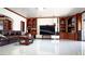 Living room featuring a large flat-screen TV and built-in wooden shelving at 3265 Rosanna St, Las Vegas, NV 89117