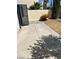 Small backyard with concrete patio and grassy area at 9417 Amber Valley Ln, Las Vegas, NV 89134