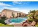 Inviting backyard oasis with a sparkling pool, spa, and covered patio at 7108 Horseshoe Cliff Ave, Las Vegas, NV 89113