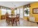 Elegant dining room with wood table and access to back patio at 7108 Horseshoe Cliff Ave, Las Vegas, NV 89113