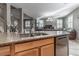 Kitchen island with granite countertops and a double sink at 615 Little Moon Ave, Las Vegas, NV 89178