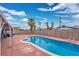 Large kidney-shaped pool with a surrounding patio at 2192 Wagonwheel Ave, Las Vegas, NV 89119