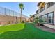 Artificial turf lawn with tiki bar and pool access at 2820 Sisteron Ct, Henderson, NV 89044