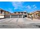 Two-story house with three-car garage and landscaped front yard at 7869 Salt Spray Ct, Las Vegas, NV 89139