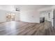 Large main bedroom with wood-look floors, access to a balcony and ceiling fan at 7869 Salt Spray Ct, Las Vegas, NV 89139