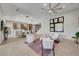 Open living area with tile floors and a view into the kitchen and dining area at 7859 W Wigwam Ave, Las Vegas, NV 89113