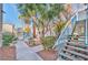 Landscaped courtyard with stairs and pool view at 4960 Harrison Dr # 214, Las Vegas, NV 89120