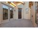 Elegant entryway with a decorative tile floor and a rich wood door at 1159 Calcione Dr, Henderson, NV 89011