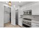 Kitchen with stainless steel appliances and laundry area at 1159 Calcione Dr, Henderson, NV 89011